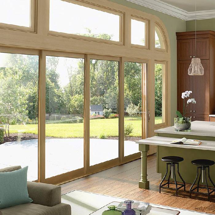 https://www.newmanwindows.com/wp-content/uploads/2020/03/Pocket-Glass-Walls-in-Aluminum-Clad-Wood.jpg